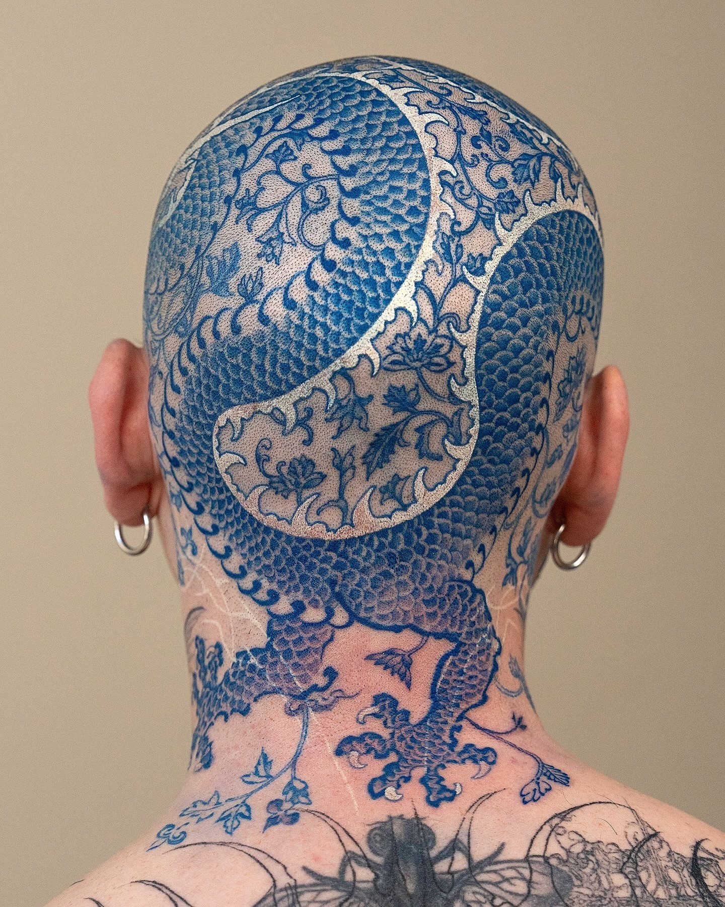 28. Title: Intricate Blue and Silver Dragon Motif