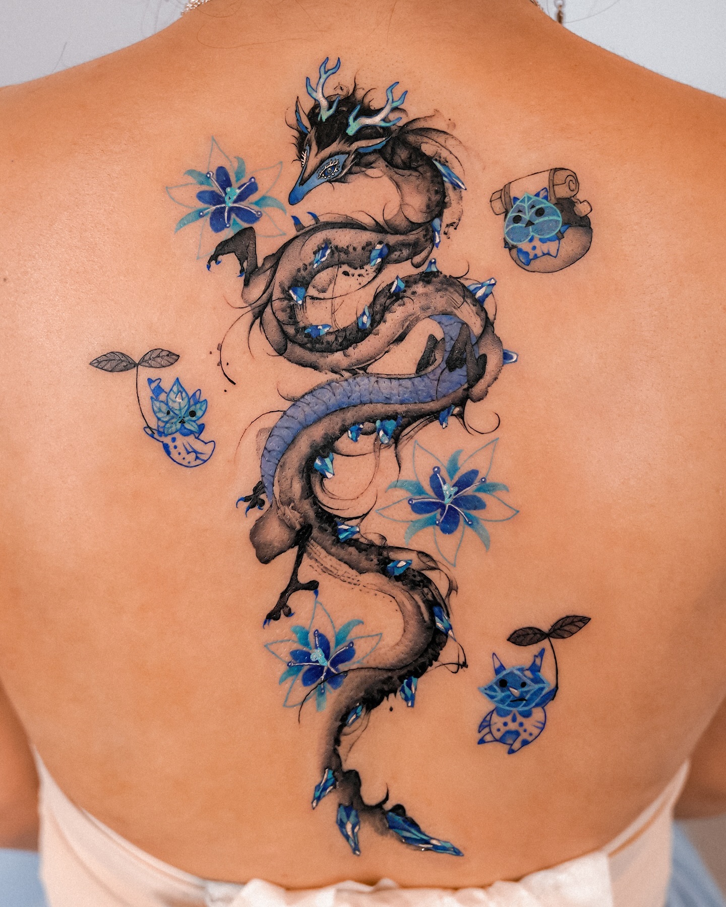 43. Intricate Blue and Black Dragon Design
