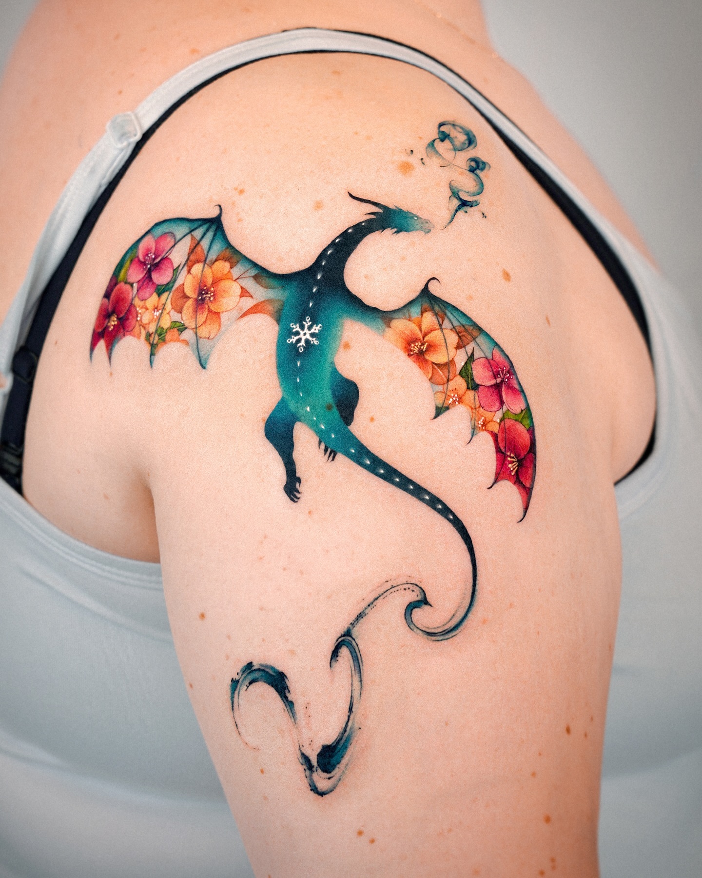 7. Title: Whimsical Dragon with Floral Accents