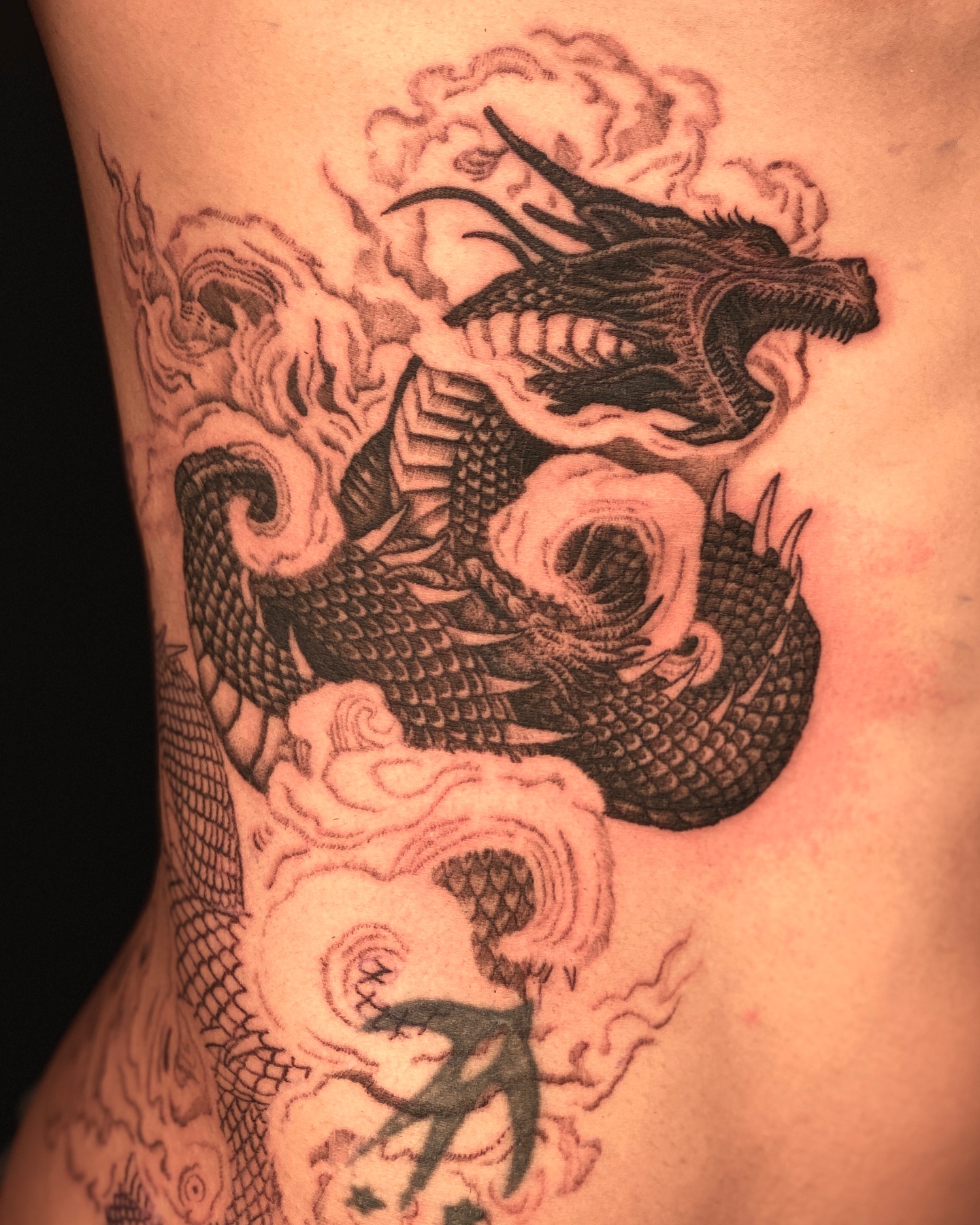 4. Intricate Black and Grey Dragon Tattoo