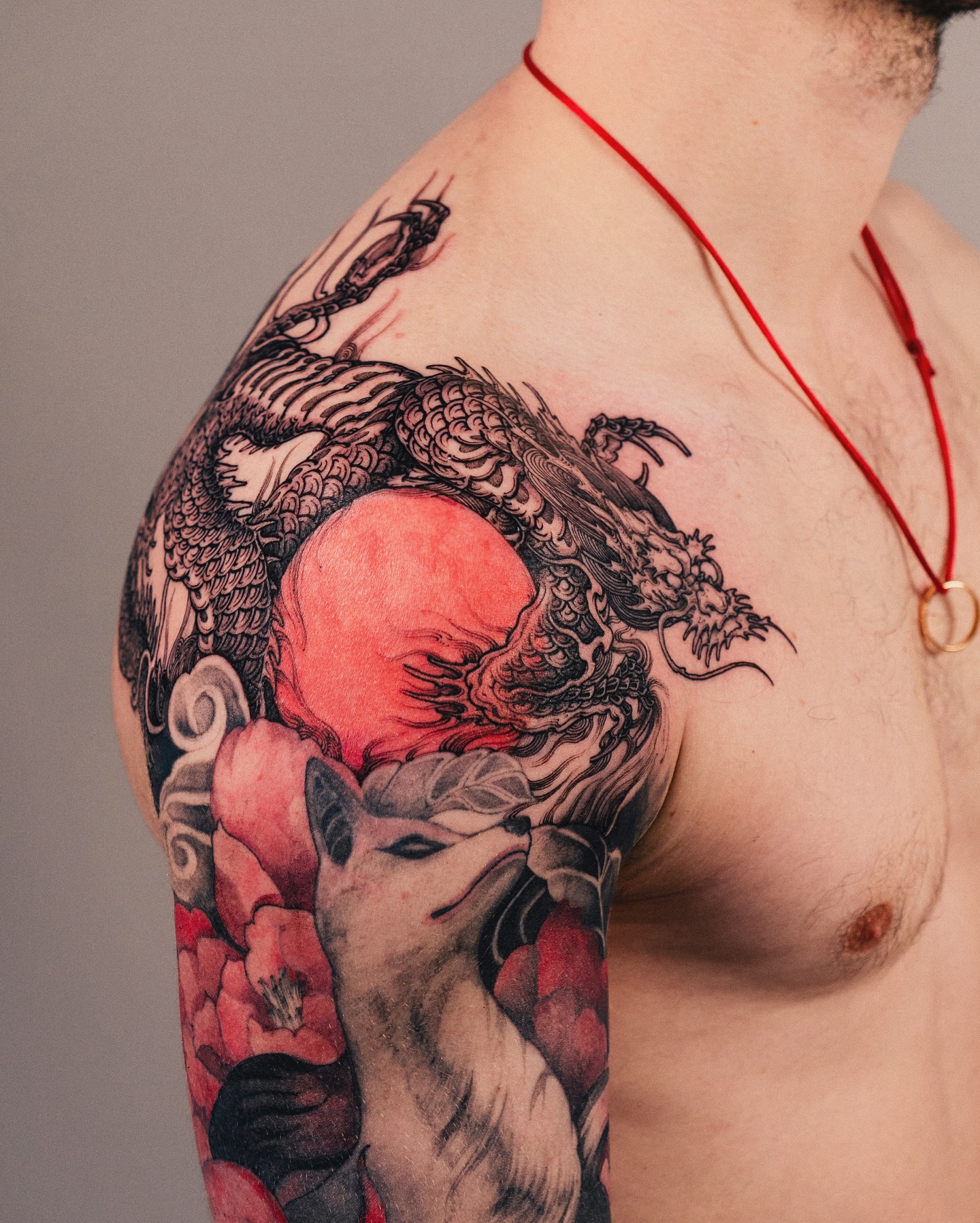 54. Title: Intricate Dragon and Fox Tattoo Artistry