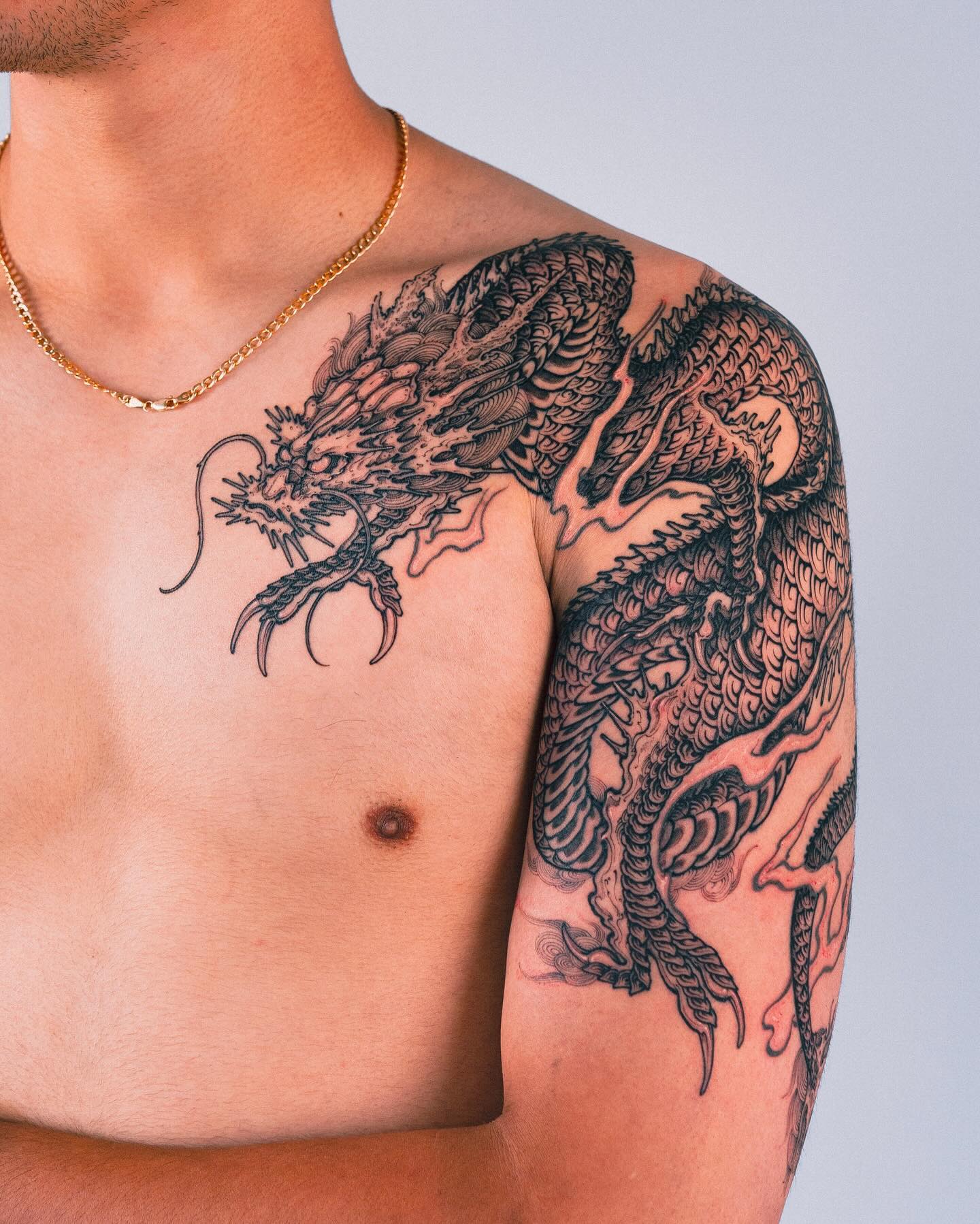 13. Title: Intricate Black and Grey Dragon Tattoo