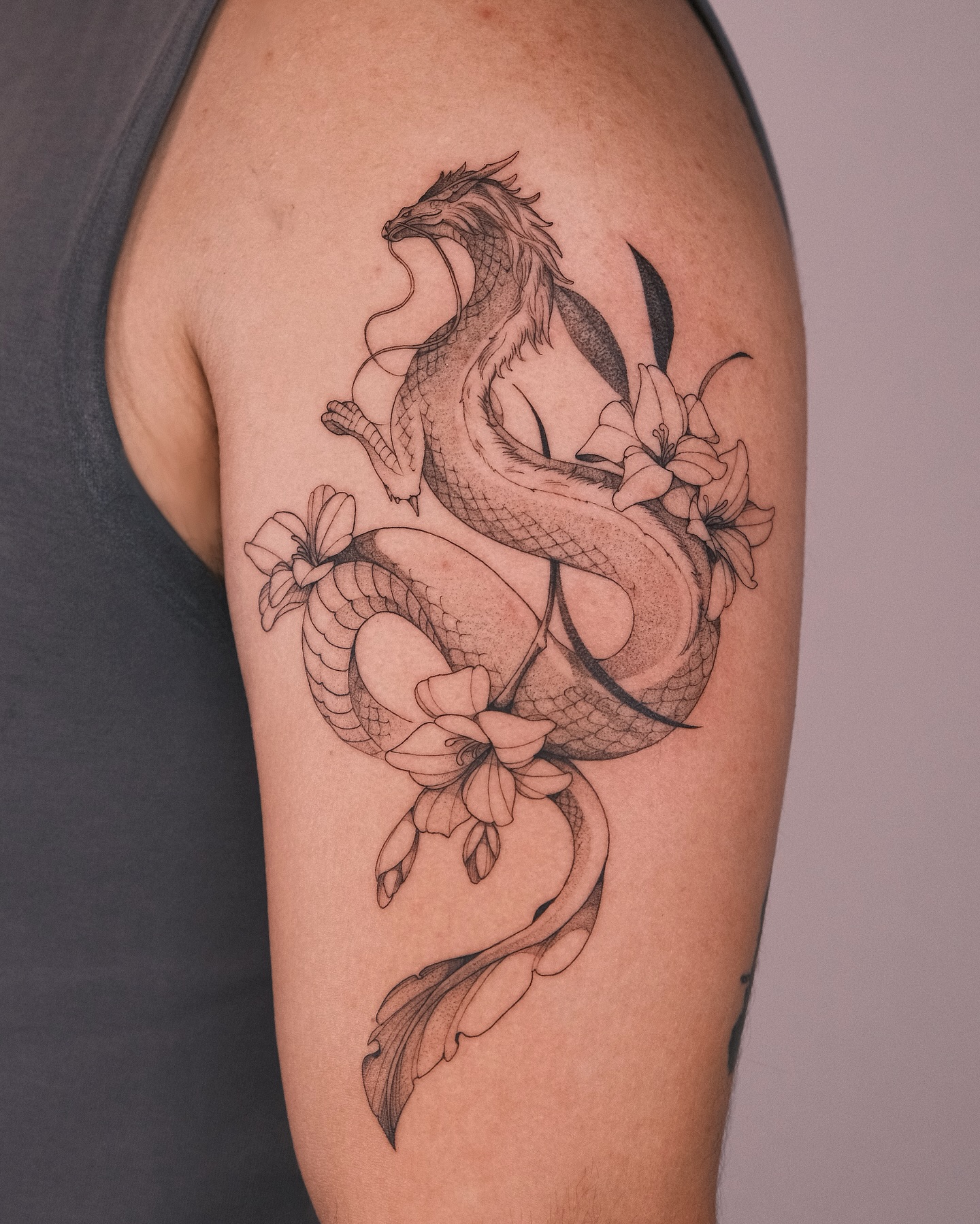14. Title: Intricate Floral Dragon Tattoo Design