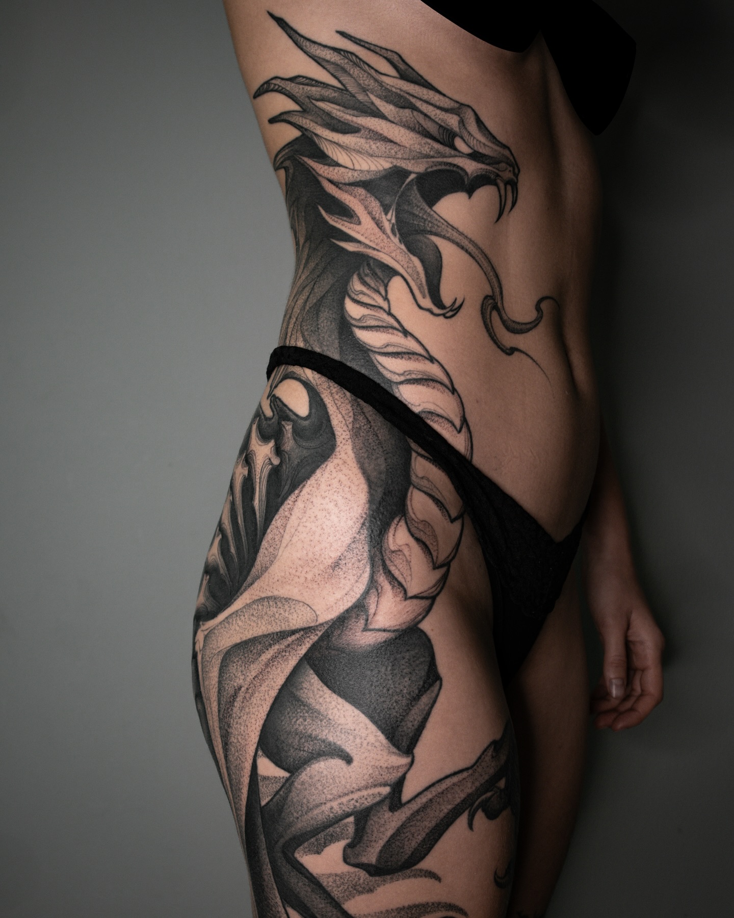 17. Title: Intricate Black and Grey Dragon Tattoo