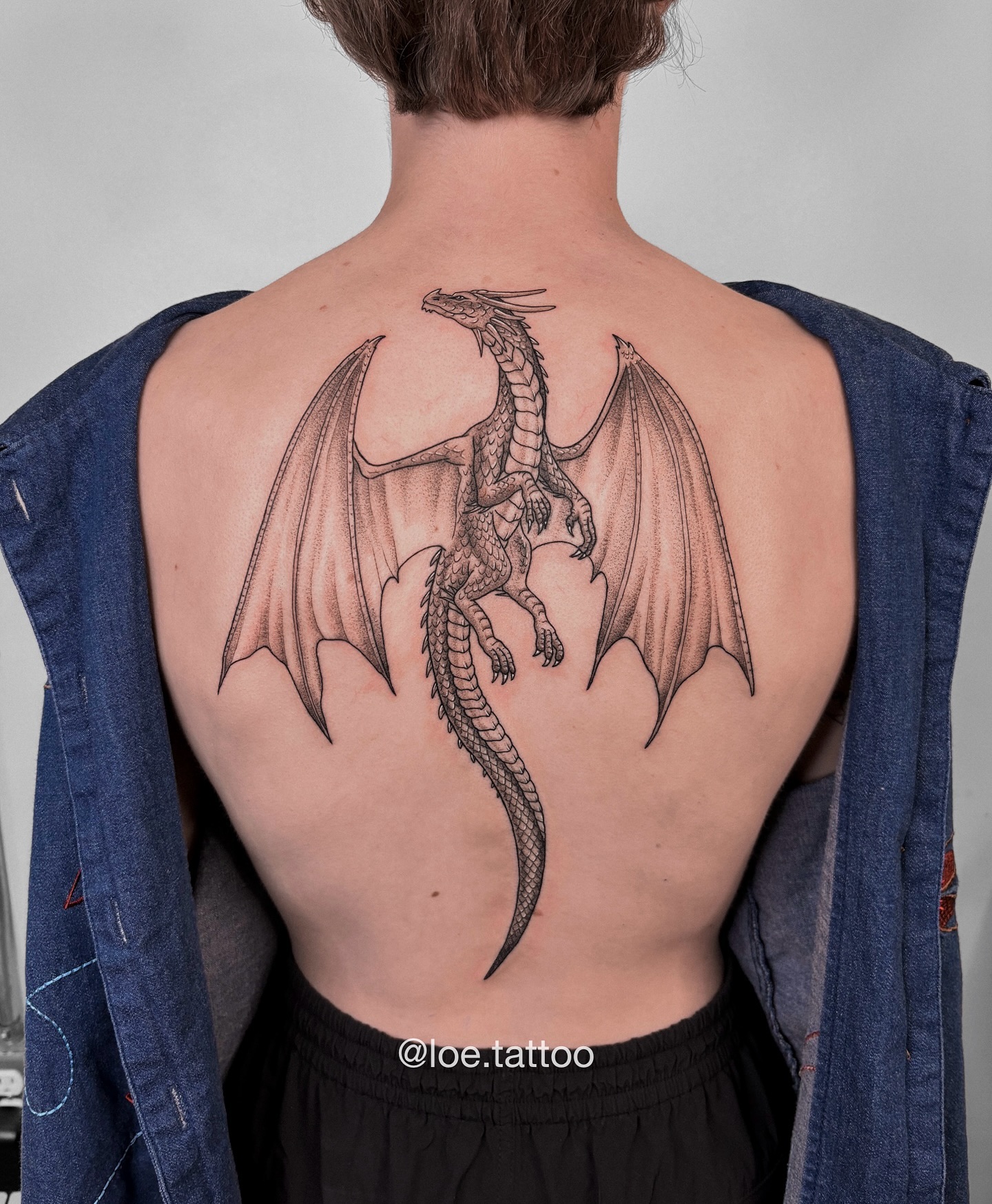 26. Title: Intricate Winged Dragon Tattoo