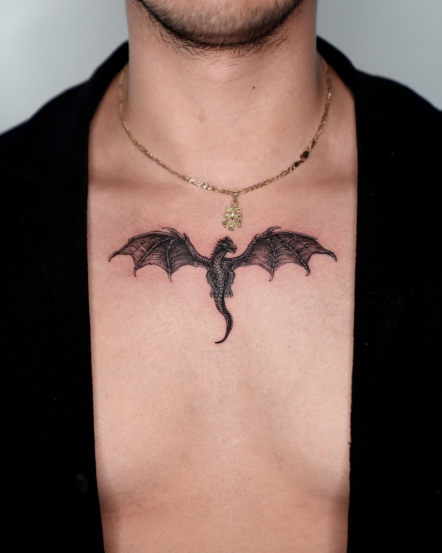 22. Intricate Dragon Silhouette Tattoo