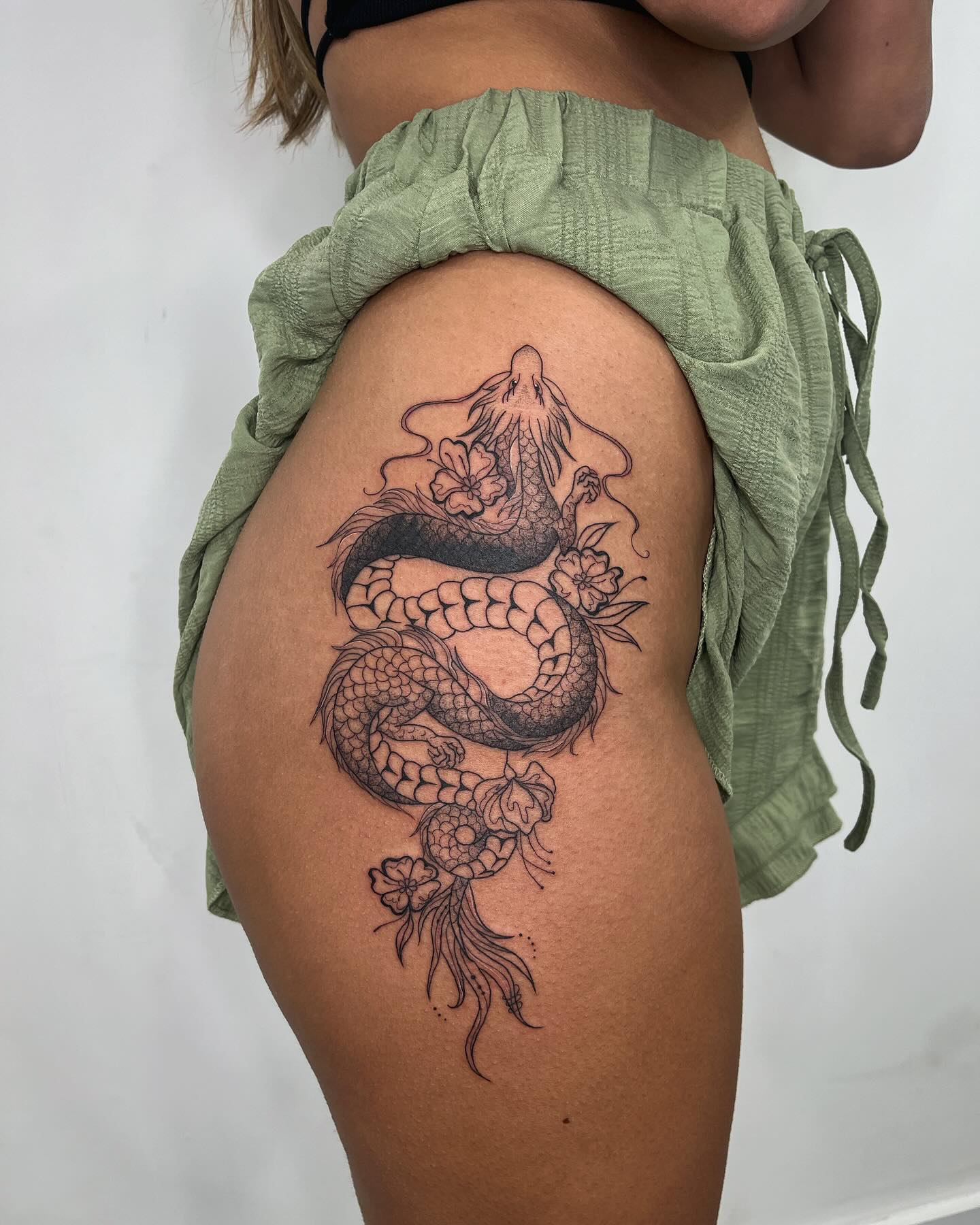 16. Intricate Black Dragon with Floral Accents