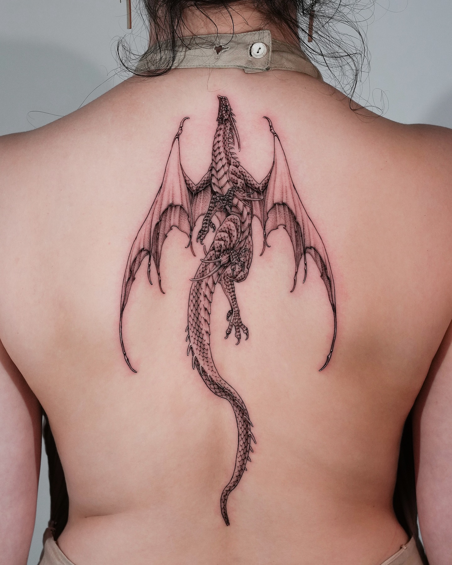 19. Intricate Winged Dragon Tattoo
