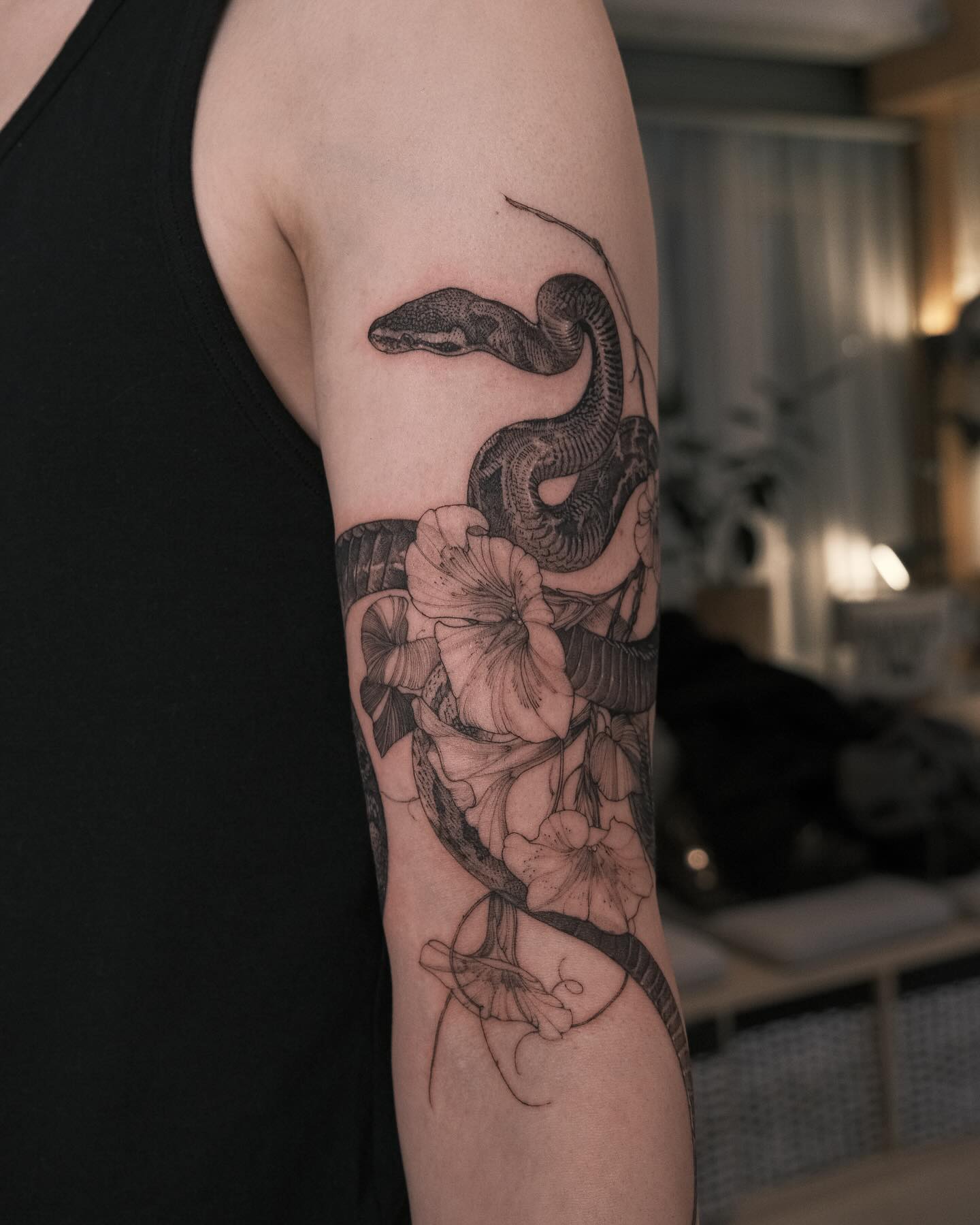 14. Serpent's Serenade: a Floral Embrace Of Inked Nature