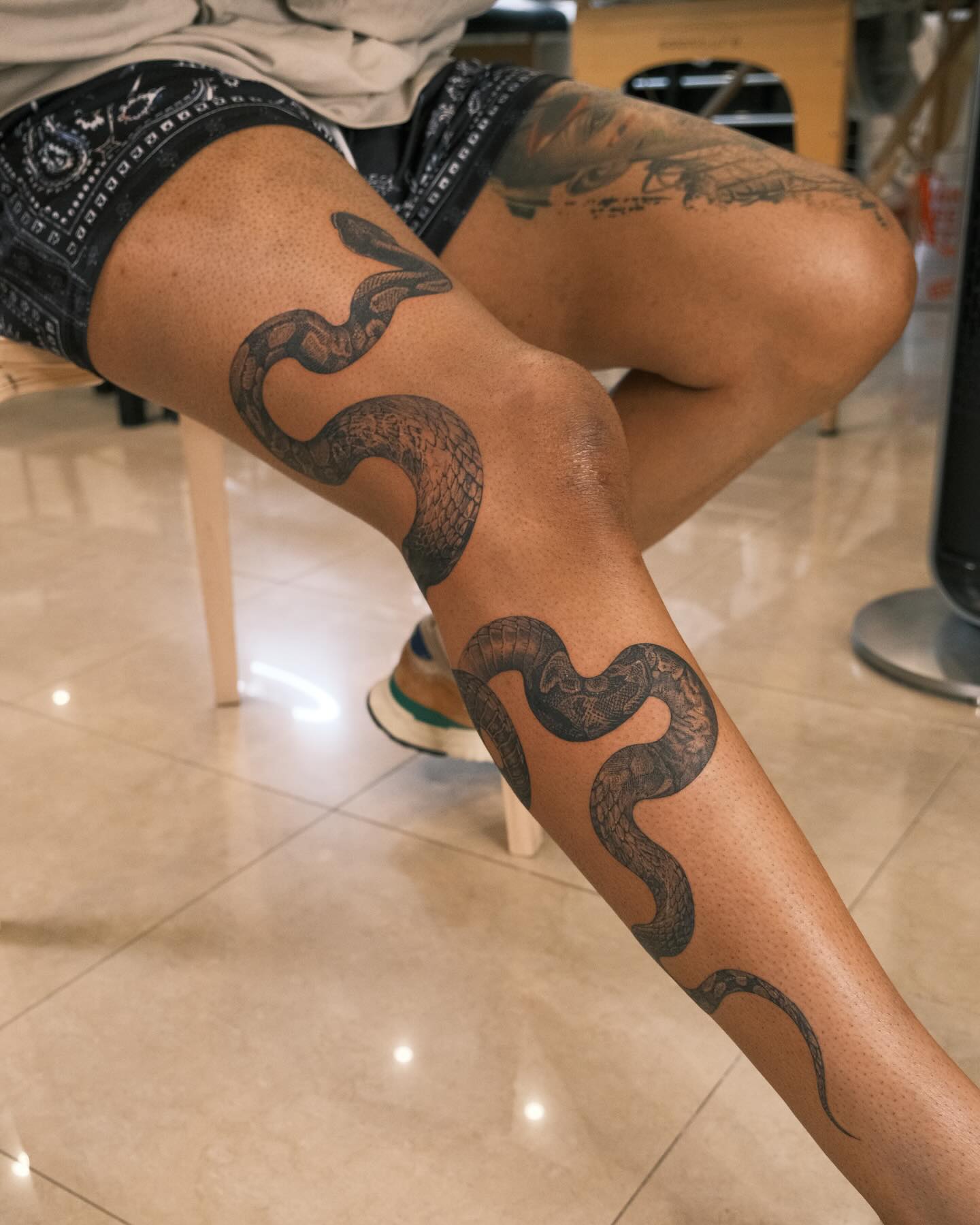 44. Serpentine Harmony: Weaving Inked Elegance Into the Canvas Of Skin