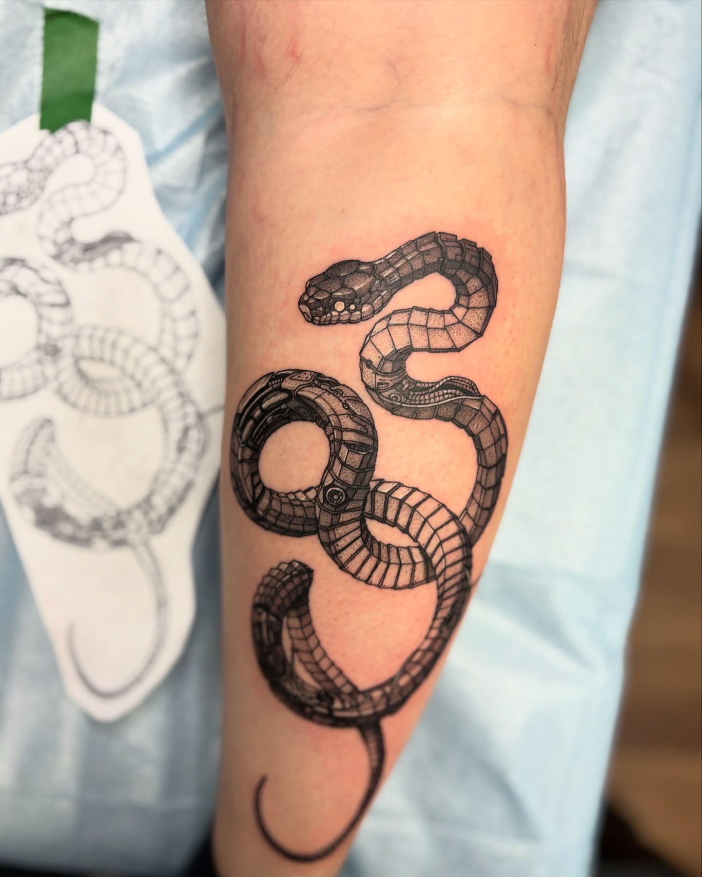 26. Sinuous Shadows: the Artistry Of a Black Wrap Snake Tattoo