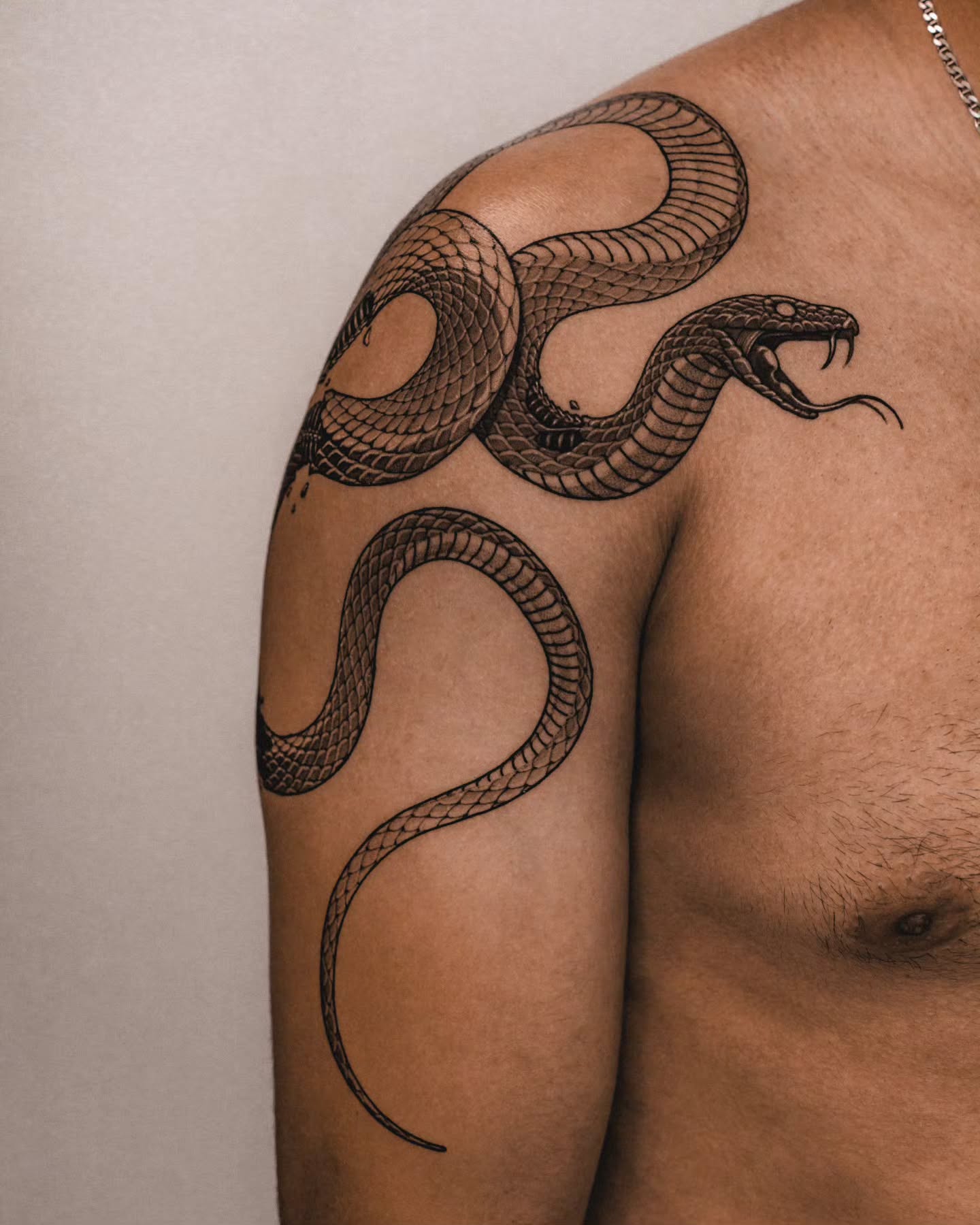 8. Serpentine Elegance: an Edgy Omen on Skin